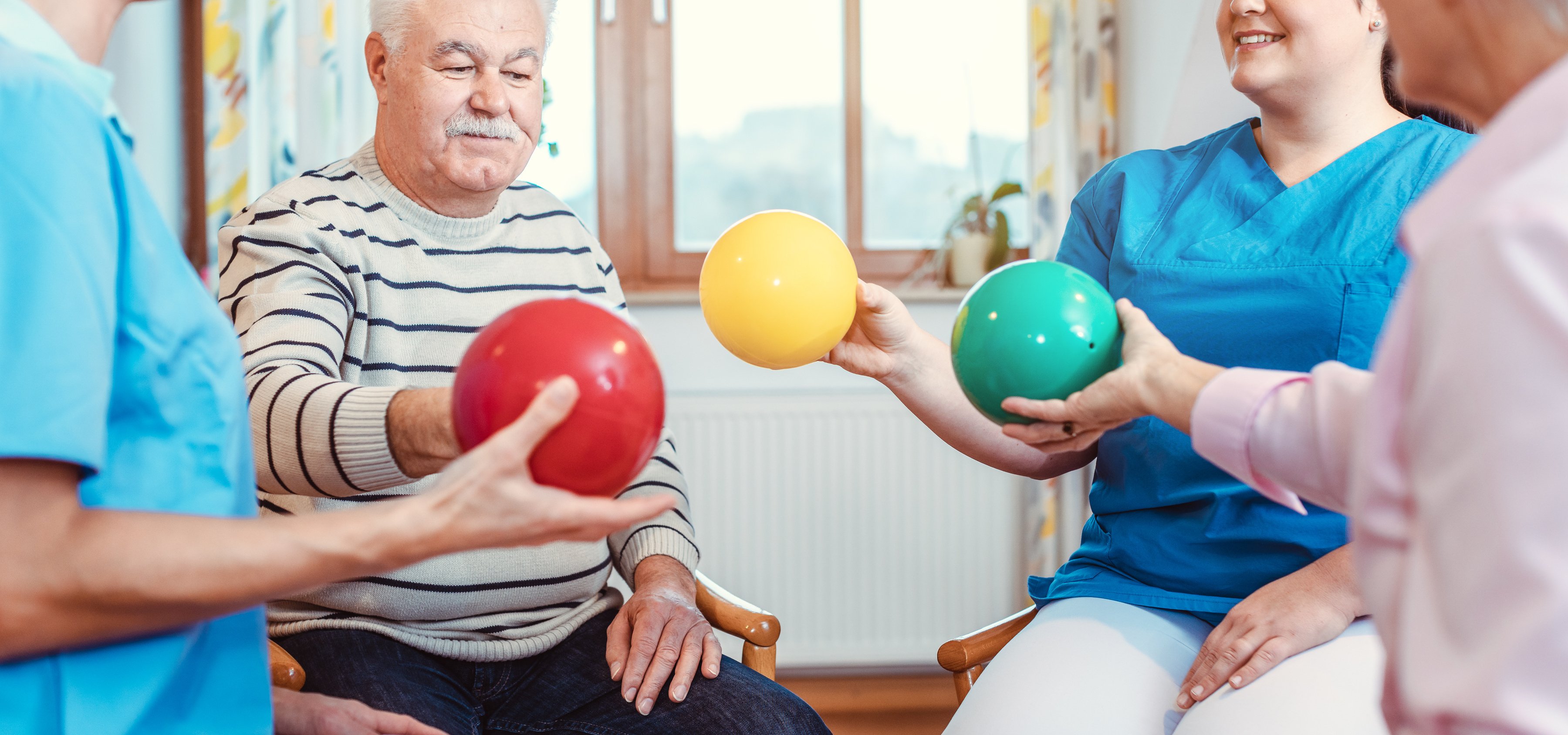 Group of Seniors Doing Sport and Gymnastics with Balls